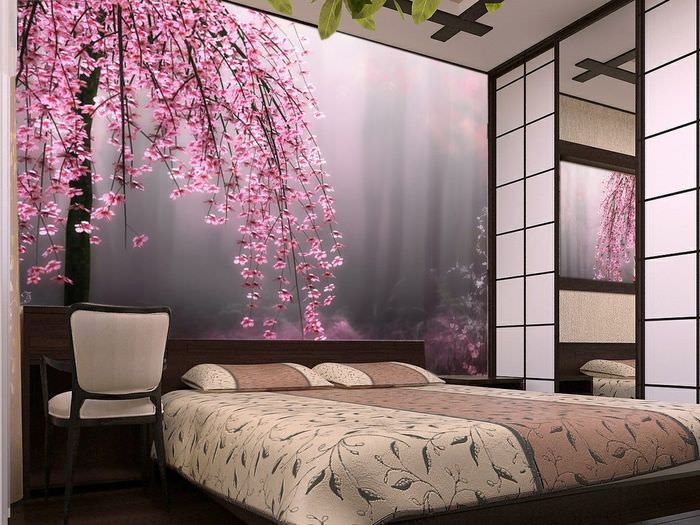 Яркие фотообои с цветущими ветками в дизайне спальни